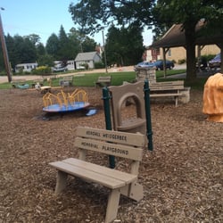 Kendall  Marie Weisgerber Memorial Playground - Bench, merry-go-round, lion water fountain, swings...