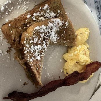 Minnie's Beach Cafe - Yes, I have to get the kids meal because the adult plate is WAY TOO MUCH for me. 1/2 order of French Toast, scrambled egg and bacon. - American Near Me - Holmes Beach, Florida