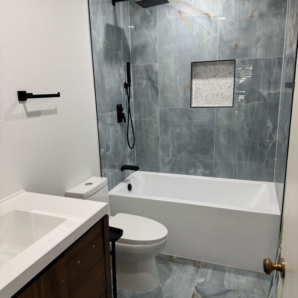 Akraba Construction - I still LOVE the tile and the LOOK of the tub and fixtures. - General Contractors Near Me