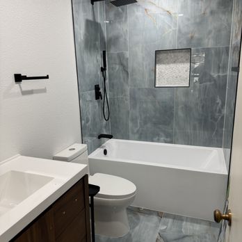 Akraba Construction - I still LOVE the tile and the LOOK of the tub and fixtures. - General Contractors Near Me
