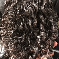 Christina Marie a Hair Boutique - During the style lesson. Curls on the right has the conditioner distributed through the hair properly. Look at the difference!