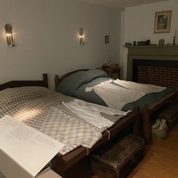 Boarding House Park - two beds in a room with a fireplace - Performing Arts Near Me - Lowell, Massachusetts