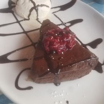 Pier M33 On The Cheboygan - Flourless Chocolate Cake with Raspberry  Compote - New American Near Me - Cheboygan, Michigan