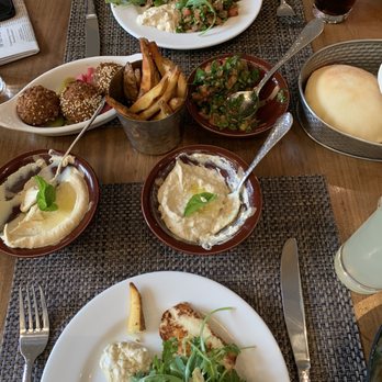 FIGS - Meza plate- hummus, baba ghanouj, fries, tabouleh & falafel served with fresh hot pita, so delicious! Also ordered the Haloumi Salad...yum - Mediterranean Near Me - Jackson, Wyoming