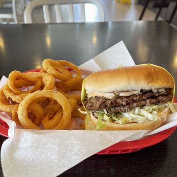 Chelo's Burgers - Double hamburger w/onion rings - Breakfast & Brunch Near Me - Indio, California Chelo's Burgers - Double hamburger w/onion rings - Breakfast & Brunch Near Me - Indio, California
