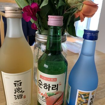 LCBO Markham - two bottles of sake and a vase of flowers - Beer, Wine & Spirits Near Me - Markham, Ontario