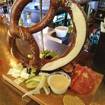 Swig - Charcuterie board; All in house made! pretzel with beer cheese dip, sopressata, capicola, corned duck, pickles, onions - Bars Near Me - Perrysburg, Ohio Swig - Charcuterie board; All in house made! pretzel with beer cheese dip, sopressata, capicola, corned duck, pickles, onions - Bars Near Me - Perrysburg, Ohio