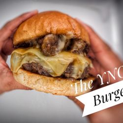 Magnolia Blues - 8oz Black Angus beef patty with braised short rib, banana peppers, Gouda cheese, and a beef demi-glace.