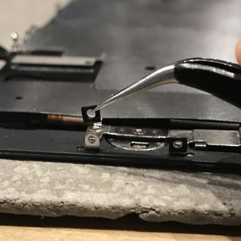 Modify My Device - Examining an iPhone screen. - Mobile Phone Repair Near Me - Chicago, Illinois Modify My Device - Examining an iPhone screen. - Mobile Phone Repair Near Me - Chicago, Illinois