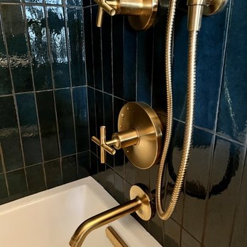 Gallery Renovation - a bathtub and shower in a bathroom - Handyman Near Me - Brooklyn, New York