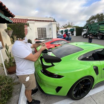 Rancho Roasters - a man standing next to a green sports car - Juice Bars & Smoothies Near Me - Rancho Santa Fe, California