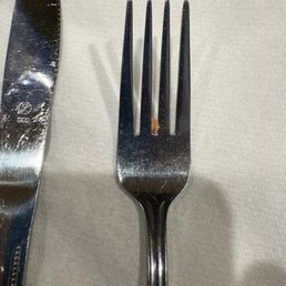 Dirty silverware that was rolled up and provided for use Dirty silverware that was rolled up and provided for use