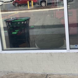 Dollar Tree - Cashier relaxing on windowsill