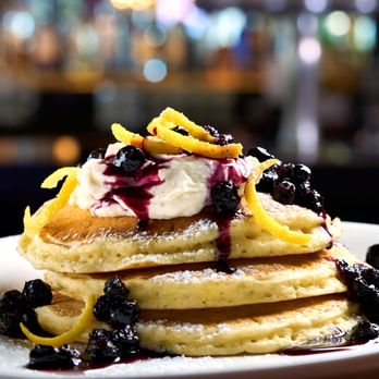 The General Public - Lemon Ricotta Pancakes topped with blueberry compote, sweet ricotta. - New American Near Me - Houston, Texas The General Public - Lemon Ricotta Pancakes topped with blueberry compote, sweet ricotta. - New American Near Me - Houston, Texas