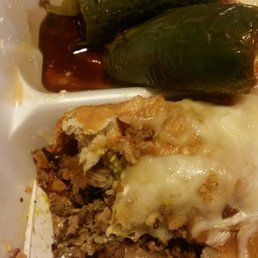 Nasty asf what kind of shit is this so disappointing. Look how dirty and oily this shit is.Look at the jalapeños. And dried ass oily burrito