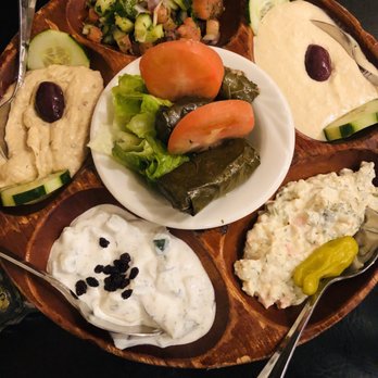 Villagio Cafe - Appetizer platter - before pic. Hummus, shirazi salad, eggplant dip (baba), tzatziki, potato salad, and dolmades - Persian/Iranian Near Me - Baltimore, Maryland