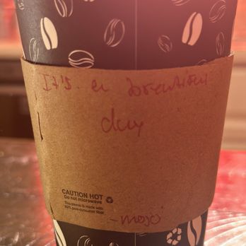 Mojo Coffee Company - Cute note on my coffee sleeve: "It's a beautiful day" - Coffee & Tea Near Me - Ellenwood, Georgia Mojo Coffee Company - Cute note on my coffee sleeve: "It's a beautiful day" - Coffee & Tea Near Me - Ellenwood, Georgia