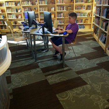 Anythink Perl Mack - He is already enjoying the perks of his library card! - Libraries Near Me - Denver, Colorado