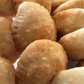 Villa Venezuela - a close up of a plate of deep fried doughnuts - Venezuelan Near Me - Sarasota, Florida Villa Venezuela - a close up of a plate of deep fried doughnuts - Venezuelan Near Me - Sarasota, Florida