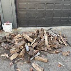 Good Earth - Firewood dumped in front of my garage