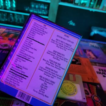 Rewind Video And Dive - a menu on a table - Dive Bars Near Me - North Kansas City, Missouri Rewind Video And Dive - a menu on a table - Dive Bars Near Me - North Kansas City, Missouri