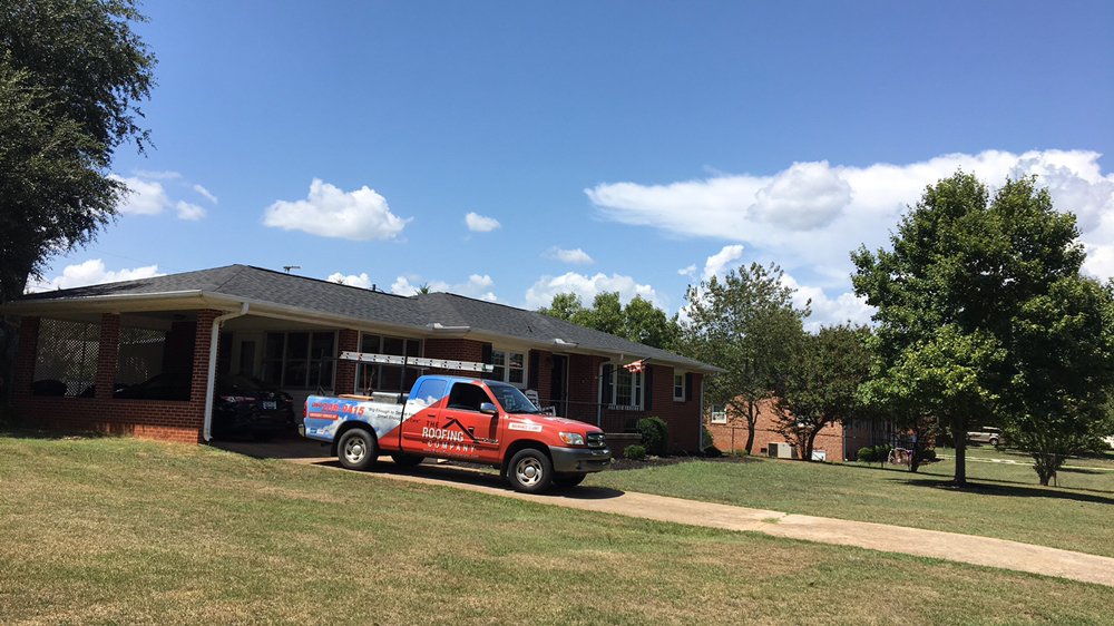 Slide of The Roofing Company
