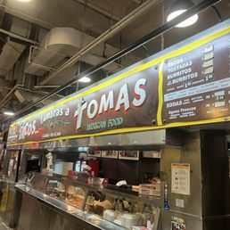 Store front and burrito that fell apart when trying to eat it.