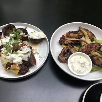 Mr West Cafe Bar Downtown - The honey roasted chicken wings and the Mediterranean street fries - Bars Near Me - Seattle, Washington Mr West Cafe Bar Downtown - The honey roasted chicken wings and the Mediterranean street fries - Bars Near Me - Seattle, Washington