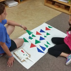 Community Montessori School - Students work with partners to use concrete materials to help with abstract concepts.