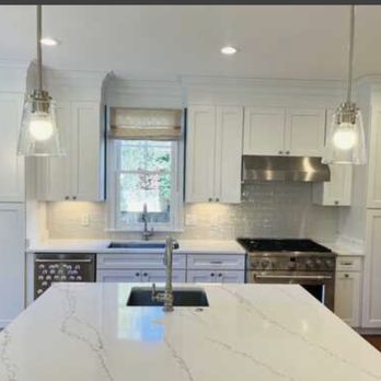 Metro Kitchen And Bath - a kitchen with white cabinets and marble countertops - General Contractors Near Me - Burke, Virginia Metro Kitchen And Bath - a kitchen with white cabinets and marble countertops - General Contractors Near Me - Burke, Virginia