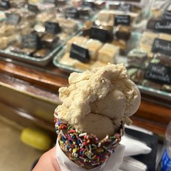 Fudgeboat - Peanut butter ripple ice cream in a premium waffle cone. And lots of Fudge in the background.