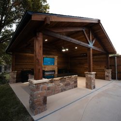 Lawrence Construction Services - Beautiful new outdoor space renovation complete with an outdoor kitchen, pool deck and handcrafted pergola perfect for hosting!