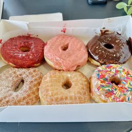 The pre-selected half dozen box (huckleberry, strawberry, chocolate, sugar, lemon, and sprinkles) The pre-selected half dozen box (huckleberry, strawberry, chocolate, sugar, lemon, and sprinkles)