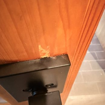 Teamwork Home Designs - The damage they caused on the door when installing new hardware - General Contractors Near Me - Austin, Texas