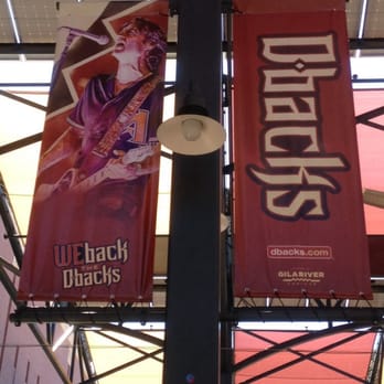 Arizona Diamondbacks - Local musician & fan favourite Roger Clyne graces one of the many banners outside Chase Field - Professional Sports Teams Near Me - Phoenix, Arizona