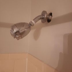 Allandale Falls - The pipe leading the water to the shower nozzle is coming out of the wall.