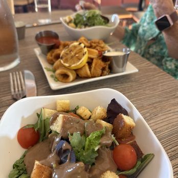 The Hideout Kitchen + Bar - The dinner salad and calamari - Comfort Food Near Me - Palm Desert, California The Hideout Kitchen + Bar - The dinner salad and calamari - Comfort Food Near Me - Palm Desert, California