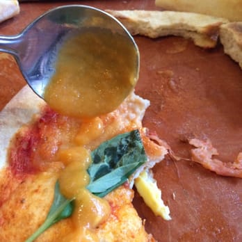Bellagio Cafe - Using the carrot ginger soup as a sauce on the margarita pizza - Italian Near Me - Vancouver, British Columbia