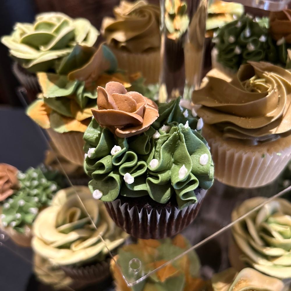 a variety of cupcakes on display a variety of cupcakes on display