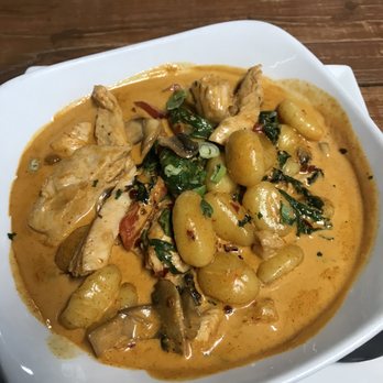 The Feast Restaurant - Chicken gnocchi in a spicy cream sauce with roasted red pepper and spinach - Seafood Near Me - Holmes Beach, Florida The Feast Restaurant - Chicken gnocchi in a spicy cream sauce with roasted red pepper and spinach - Seafood Near Me - Holmes Beach, Florida