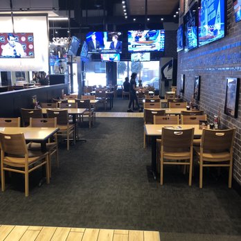 Buffalo Wild Wings - Empty floor. So why am I seated next to a full table and trash? - Chicken Wings Near Me - Aurora, Colorado Buffalo Wild Wings - Empty floor. So why am I seated next to a full table and trash? - Chicken Wings Near Me - Aurora, Colorado
