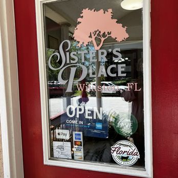 Sister's Place - The entry. It shares half of a house. The other side is a beauty salon. - Southern Near Me - Williston, Florida