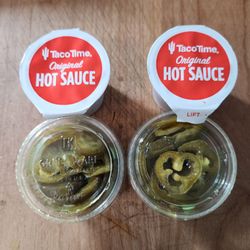 Taco Time - Hot sauce is in sealed cups now. Tastes the same and still free.