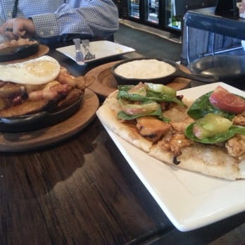 Bosscat Kitchen & Libations - Plethora of deLicious -ness... Bourbon bbq chicken flatbread,  pork belly poutine, side of gouda cheese grits - New American Near Me - Irvine, California