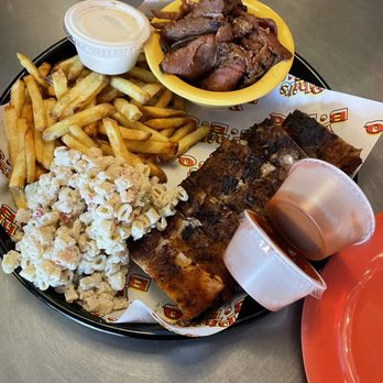 Phil's BBQ - 7 oz tri tip, pork baby back ribs , mac salad, fries and a drink for $40 - Barbeque Near Me - San Diego, California Phil's BBQ - 7 oz tri tip, pork baby back ribs , mac salad, fries and a drink for $40 - Barbeque Near Me - San Diego, California