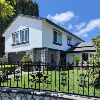 Roger's Painting - 2 story home painted in White and Iron Ore. Metal gates are painted in Black. - Painters Near Me - Corona, California Roger's Painting - 2 story home painted in White and Iron Ore. Metal gates are painted in Black. - Painters Near Me - Corona, California