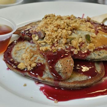 Fat City Eats, Treats and Sweets - Blue corn pancakes swimming in pool of raspberry coulis, with granola topping & cup of pure maple syrup. - Bakeries Near Me - Albuquerque, New Mexico Fat City Eats, Treats and Sweets - Blue corn pancakes swimming in pool of raspberry coulis, with granola topping & cup of pure maple syrup. - Bakeries Near Me - Albuquerque, New Mexico