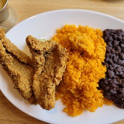 Brasa Rotisserie - Fried catfish plate with rice and beans.