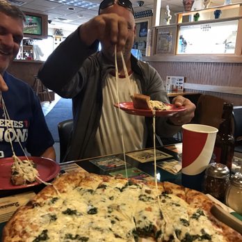 Harris Pizza #1 - Stretching that awesome mozzarella cheese! - Pizza Near Me - Rock Island, Illinois