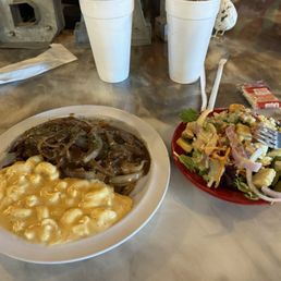 Smothered Pork chop Mac and cheese (unreal) and salad bar Smothered Pork chop Mac and cheese (unreal) and salad bar